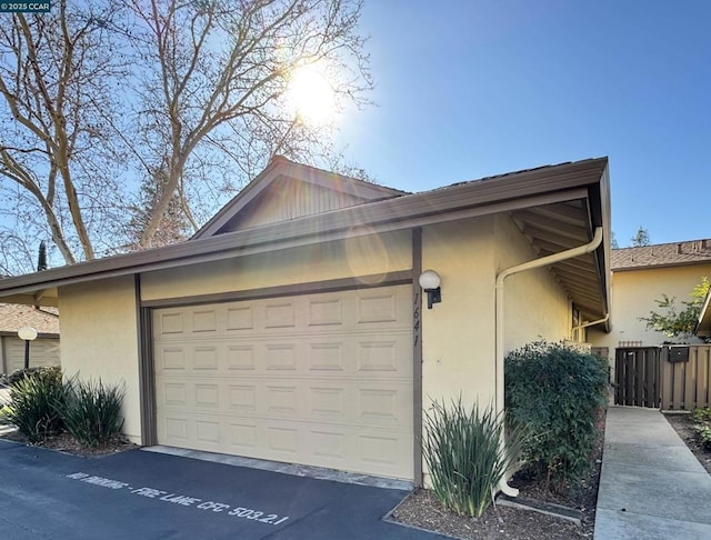 view of side of property with a garage