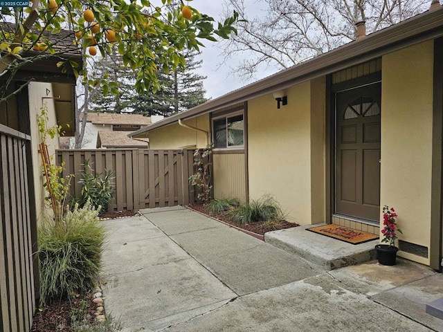 doorway to property featuring a patio