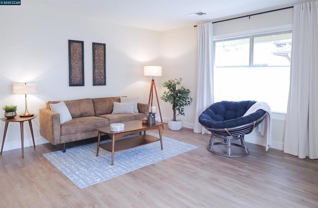 living room with light hardwood / wood-style floors