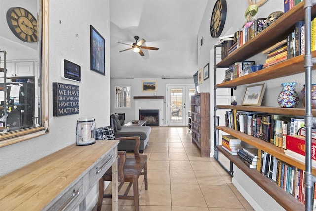 interior space with ceiling fan and high vaulted ceiling