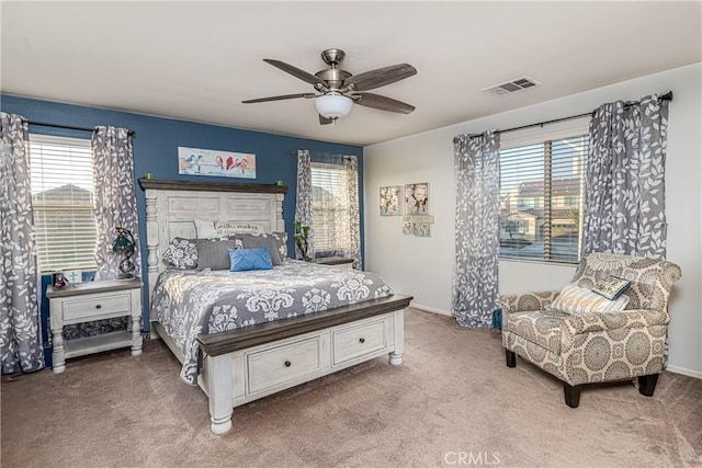 bedroom with multiple windows, carpet floors, and ceiling fan