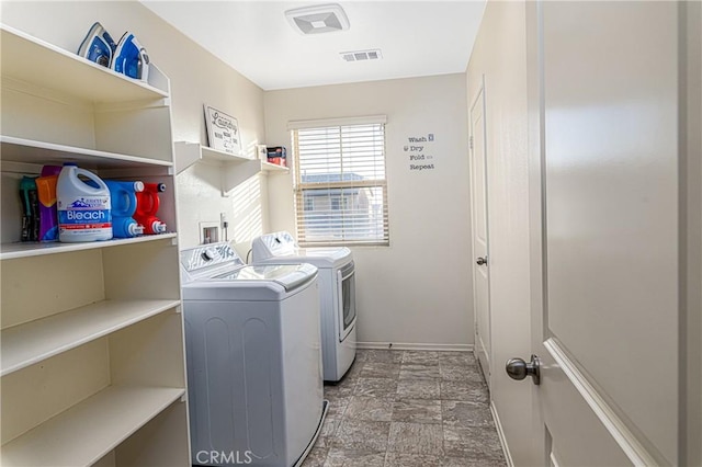 clothes washing area featuring washing machine and dryer