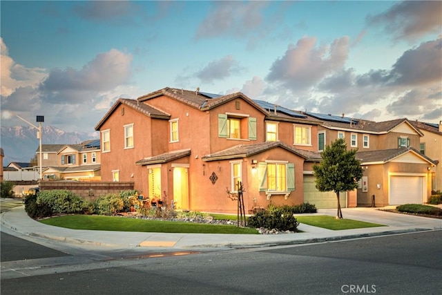 view of front of property featuring solar panels