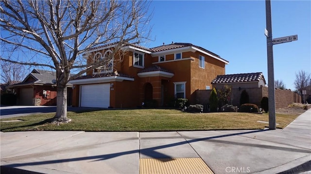 view of front facade featuring a garage and a front lawn