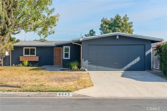 single story home featuring a garage