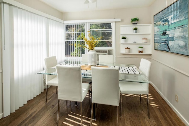 dining area with dark wood-type flooring and cooling unit