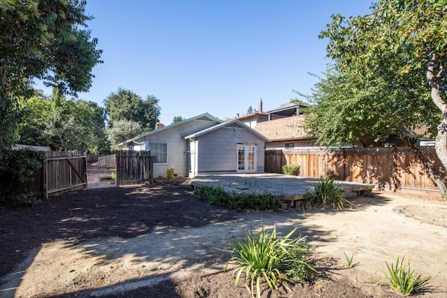 back of house with a patio and french doors