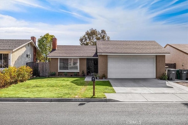 ranch-style home with a garage and a front yard