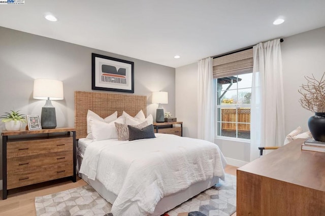 bedroom with light wood-type flooring