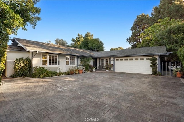 ranch-style home featuring a garage