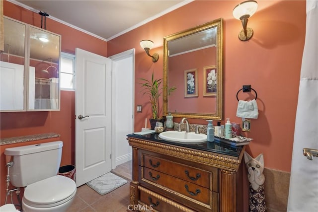 bathroom with tile patterned floors, ornamental molding, toilet, and vanity