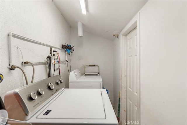 laundry room featuring separate washer and dryer