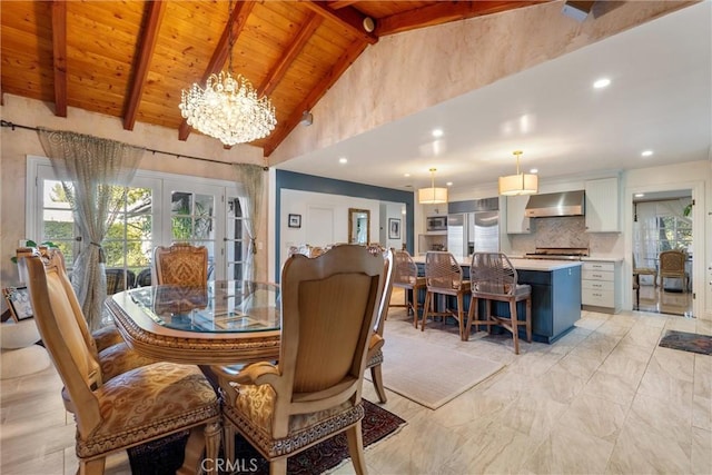 dining area featuring french doors, wooden ceiling, a chandelier, and vaulted ceiling with beams