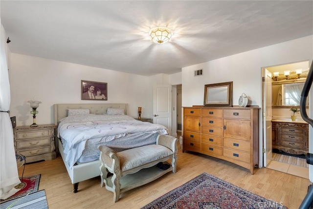 bedroom featuring light wood-type flooring