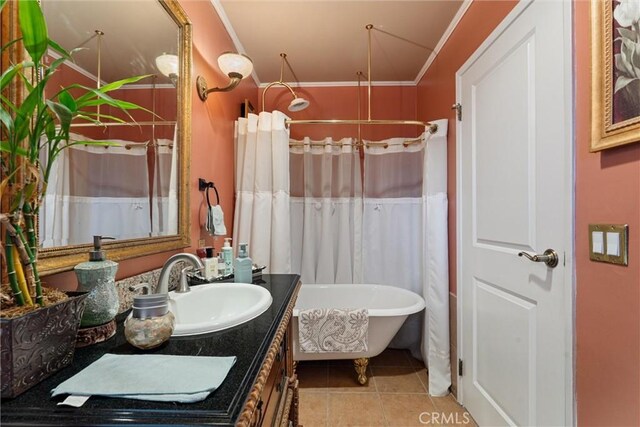 bathroom with tile patterned flooring, ornamental molding, independent shower and bath, and vanity