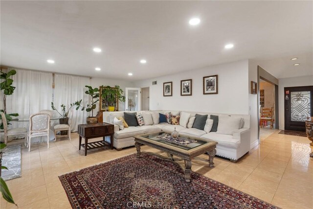 living room with light tile patterned floors