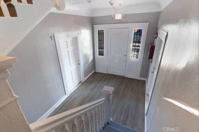 entrance foyer with dark hardwood / wood-style flooring and ceiling fan