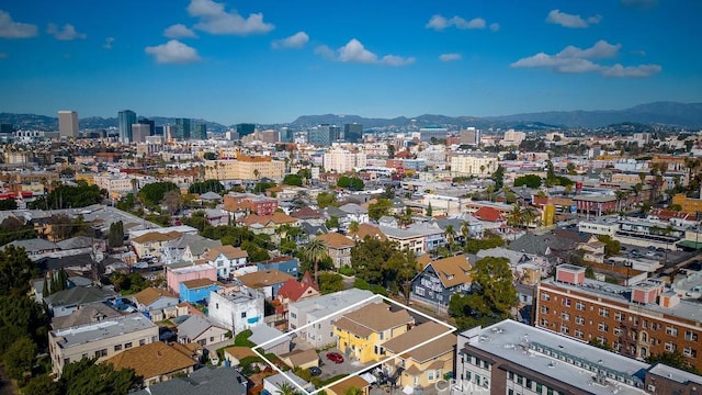 birds eye view of property with a mountain view