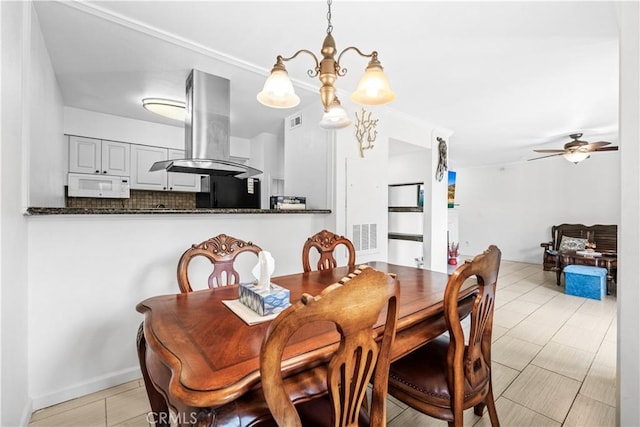 dining area with ceiling fan with notable chandelier