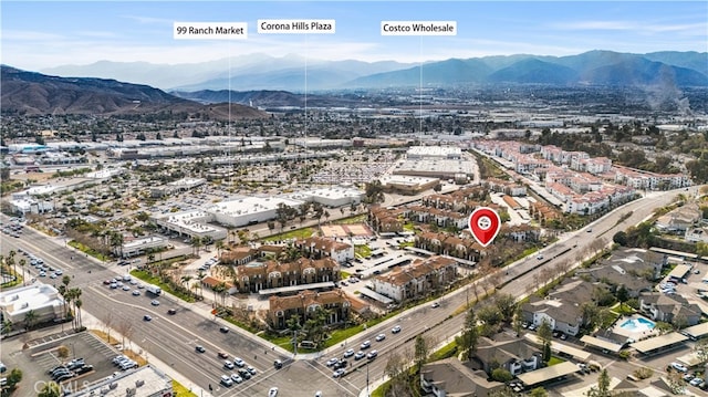 birds eye view of property with a mountain view