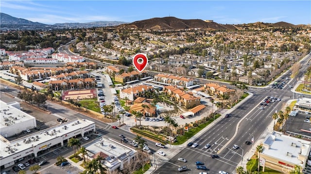 birds eye view of property with a mountain view