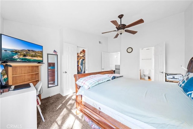 bedroom featuring ceiling fan, carpet flooring, a closet, and a spacious closet