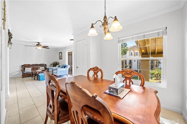 dining room featuring ornamental molding and ceiling fan with notable chandelier