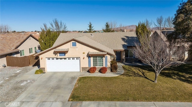 view of front of house with a garage and a front lawn