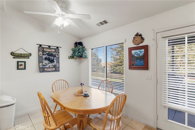 dining area featuring light tile patterned flooring, ceiling fan, and a wealth of natural light