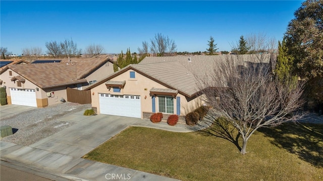 view of front of house with a garage and a front lawn