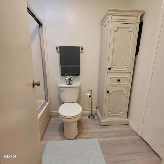 bathroom with wood-type flooring and toilet