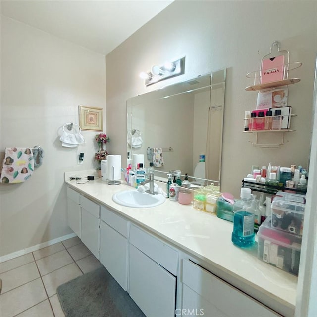 bathroom with tile patterned flooring and vanity