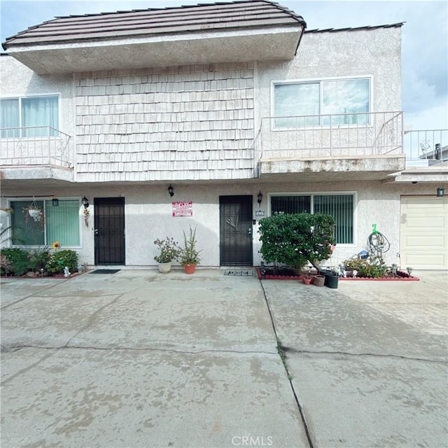 view of property with a balcony