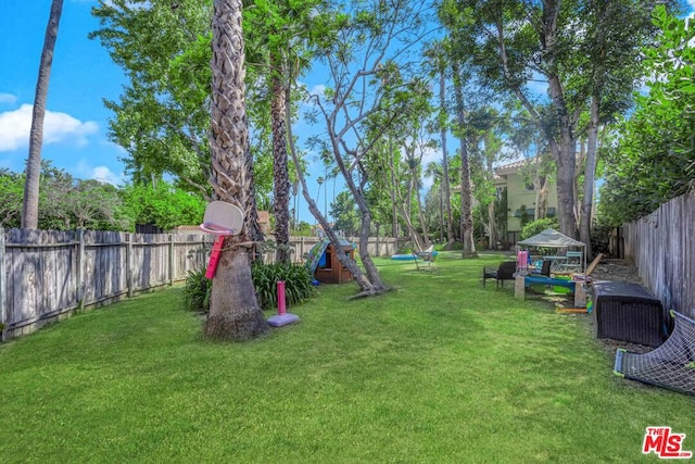 view of yard featuring a playground and a gazebo