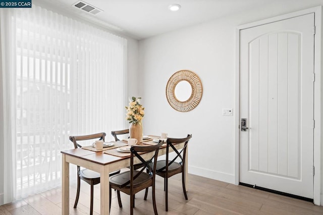 dining space featuring light hardwood / wood-style floors