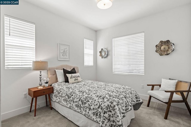 bedroom featuring light colored carpet