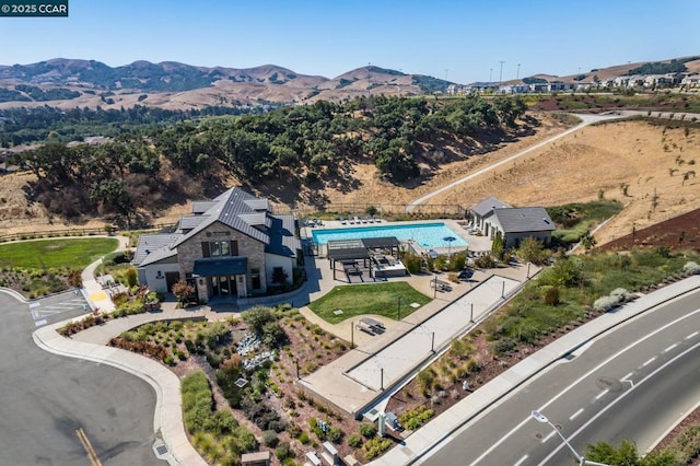 birds eye view of property featuring a mountain view