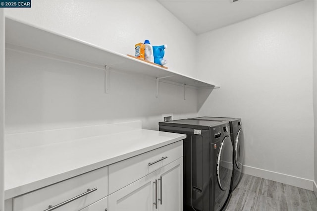 laundry area featuring cabinets and independent washer and dryer