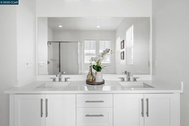 bathroom with vanity and an enclosed shower