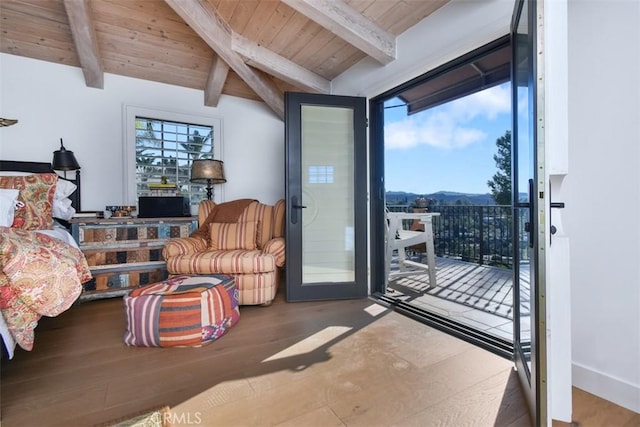 bedroom with multiple windows, hardwood / wood-style flooring, and wooden ceiling