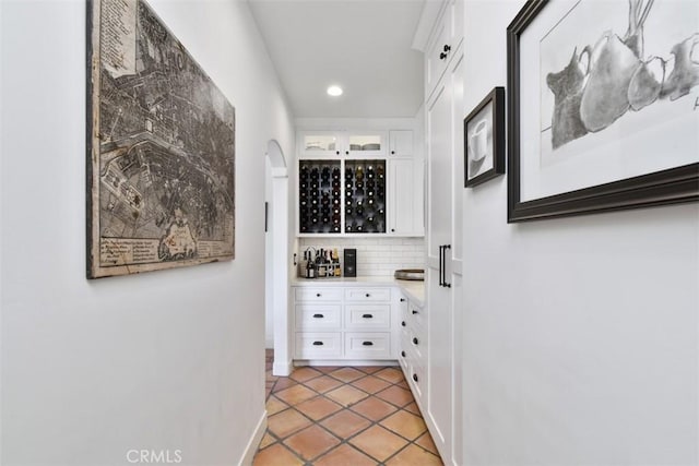 hall featuring light tile patterned floors