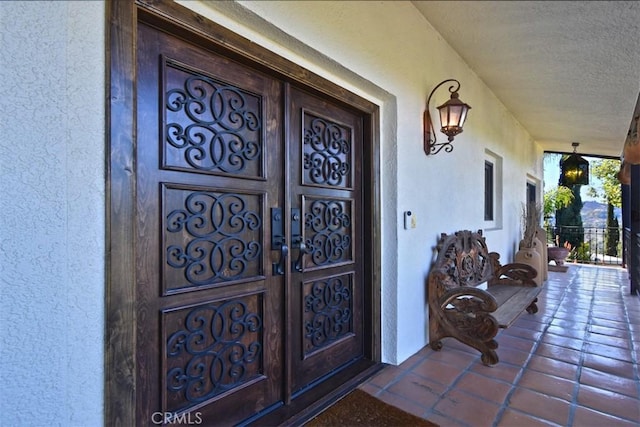 property entrance with covered porch