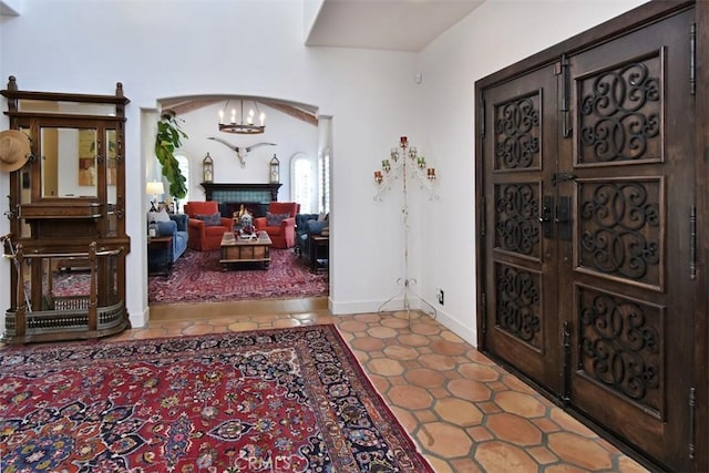 interior space with an inviting chandelier and light tile patterned floors