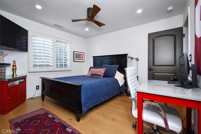 bedroom featuring ceiling fan and light hardwood / wood-style flooring