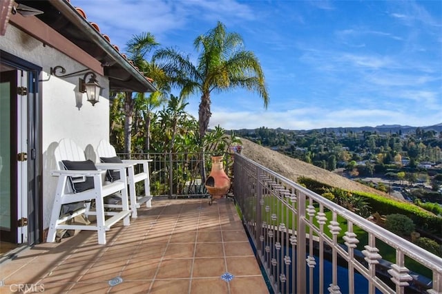 balcony featuring a mountain view