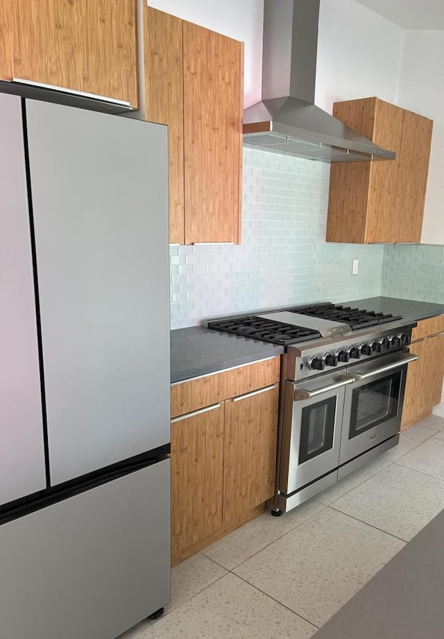 kitchen with stainless steel appliances, tasteful backsplash, and ventilation hood