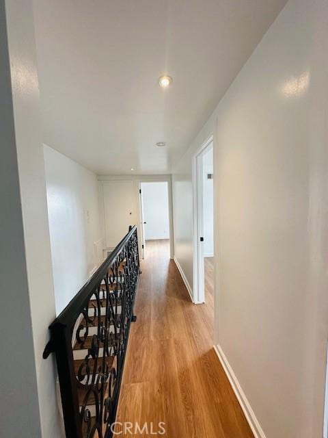 corridor featuring hardwood / wood-style flooring