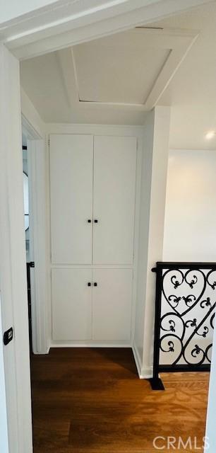 hallway featuring dark hardwood / wood-style flooring