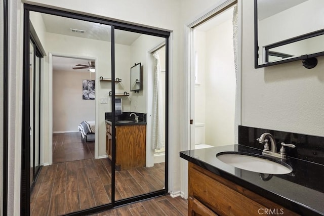 bathroom with vanity and ceiling fan