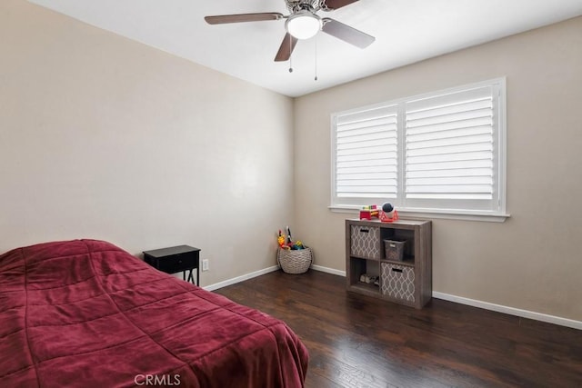 bedroom featuring ceiling fan and dark hardwood / wood-style floors